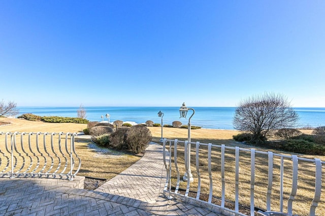 property view of water featuring fence