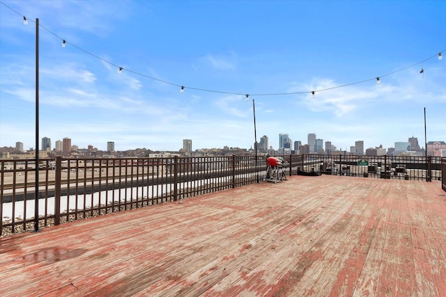 wooden deck with a view of city