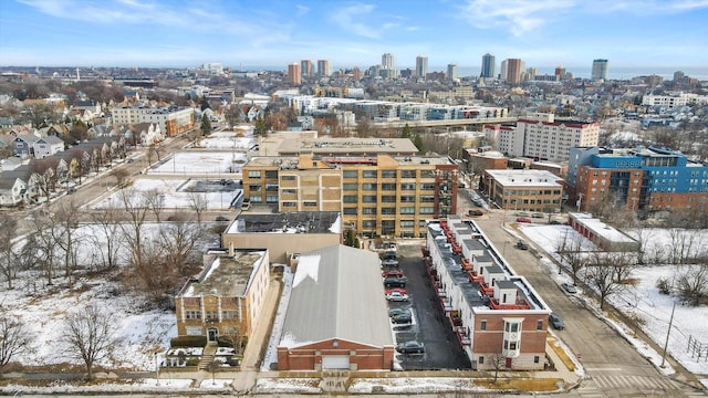 snowy aerial view featuring a city view