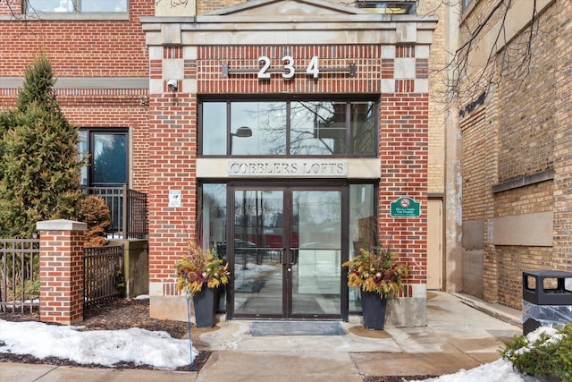 entrance to property with french doors and brick siding