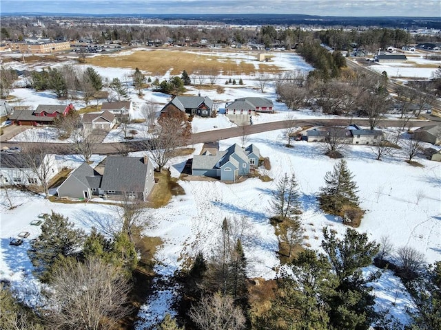 snowy aerial view featuring a residential view