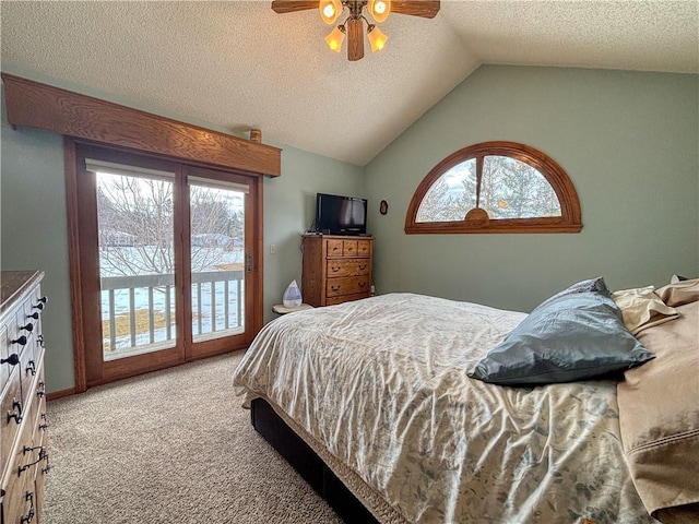 bedroom with light carpet, ceiling fan, access to outside, vaulted ceiling, and a textured ceiling