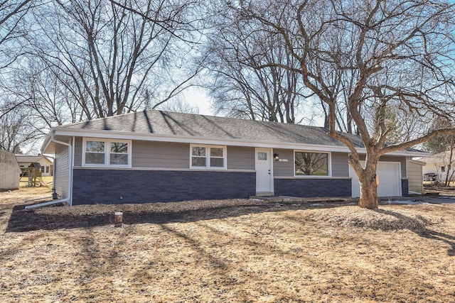 ranch-style home with brick siding and an attached garage