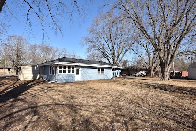 view of home's exterior with a yard