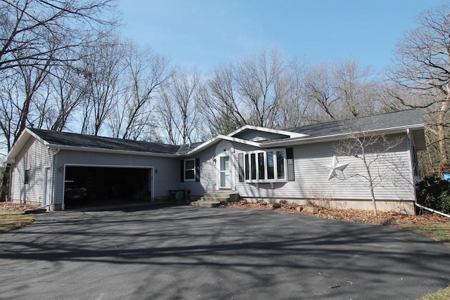 313 Carriage Rd, Montello, WI 53949 - view of front of house featuring a garage and driveway
