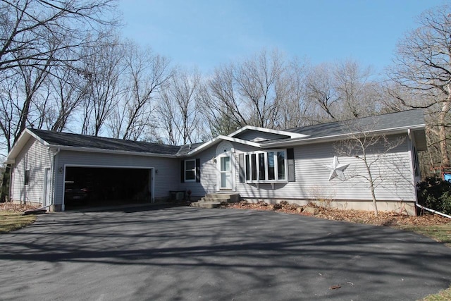 view of front of house featuring a garage and driveway