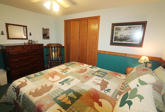 bedroom featuring ceiling fan and a closet