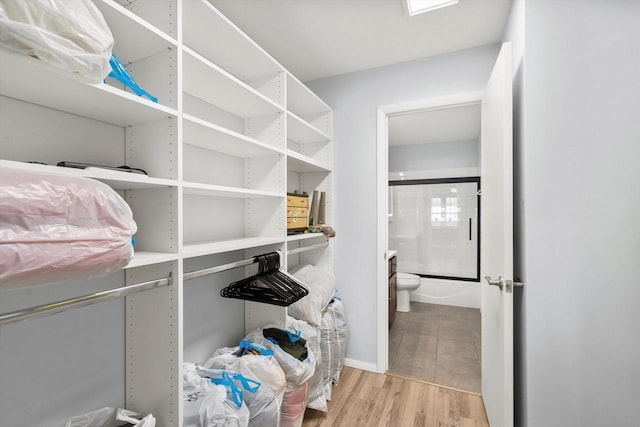 spacious closet featuring wood finished floors