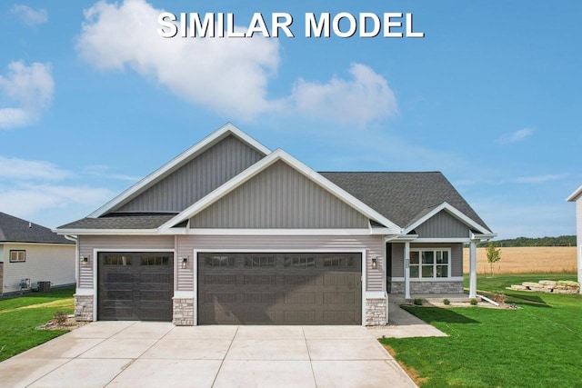 craftsman house with a garage, a shingled roof, concrete driveway, stone siding, and a front lawn