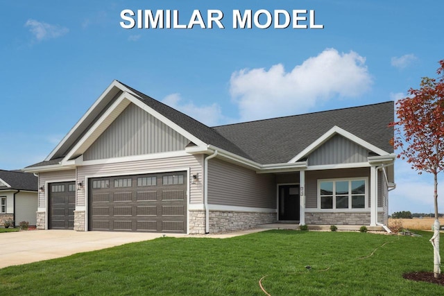 craftsman-style home featuring a front yard, stone siding, an attached garage, and concrete driveway