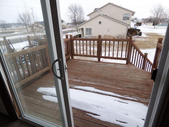 view of snow covered deck