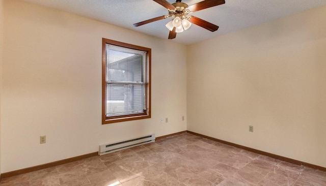 empty room with ceiling fan, baseboards, baseboard heating, and a textured ceiling