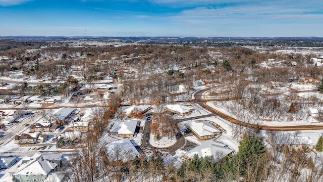 snowy aerial view with a residential view