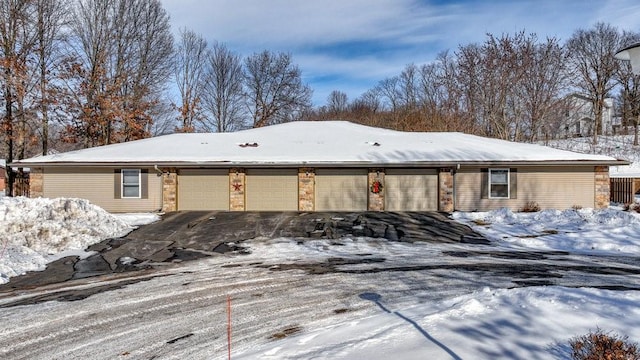 ranch-style home with a garage