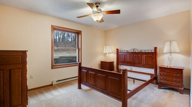 bedroom with light carpet, a baseboard radiator, and baseboards