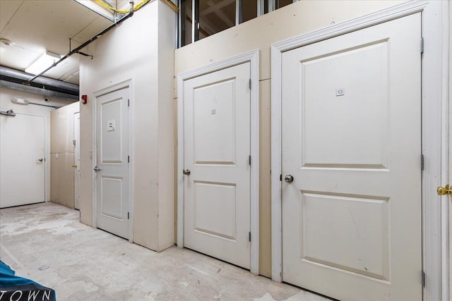 interior space with unfinished concrete flooring