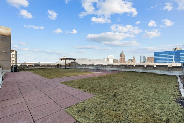 view of yard featuring a patio and a city view