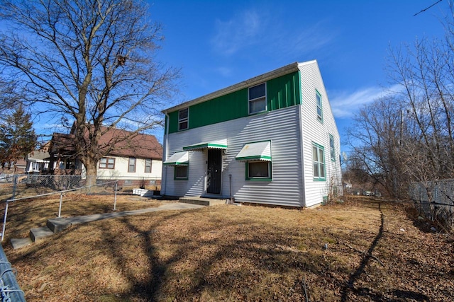 view of front of home featuring a fenced backyard