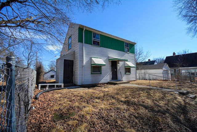 view of front of house featuring fence