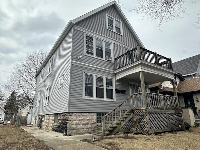 view of front of home with a porch and stairs