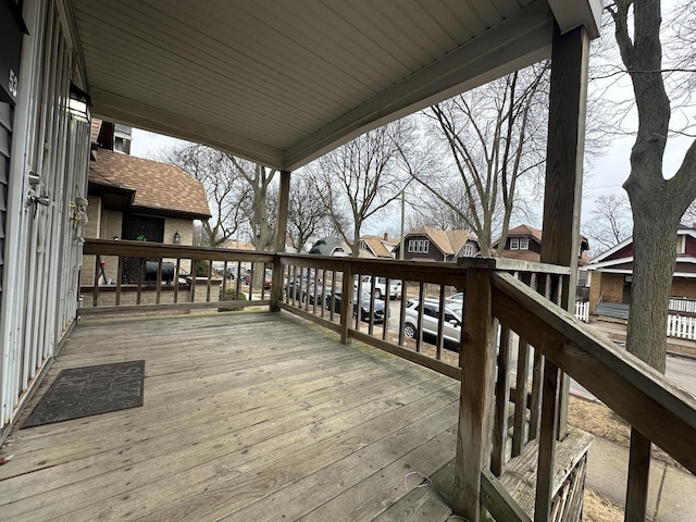 wooden terrace with a residential view