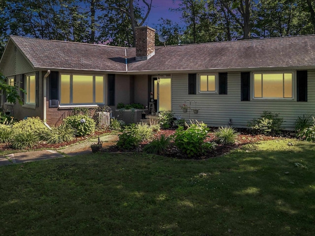 605 S Adams Ave, Marshfield, WI 54449 - single story home featuring a front yard, roof with shingles, and a chimney