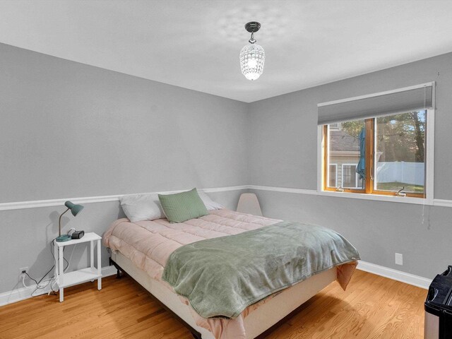 605 S Adams Ave, Marshfield, WI 54449 - bedroom with baseboards and wood finished floors