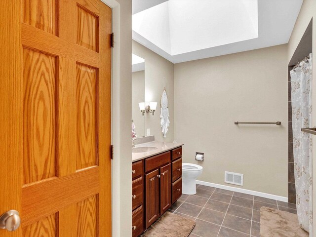 605 S Adams Ave, Marshfield, WI 54449 - bathroom featuring tile patterned flooring, toilet, vanity, visible vents, and a shower with curtain