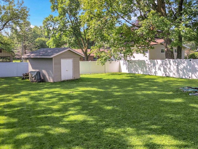 605 S Adams Ave, Marshfield, WI 54449 - view of yard featuring a fenced backyard, a shed, and an outbuilding