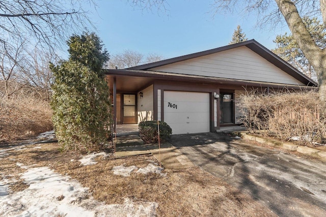 view of front of property with a garage and driveway