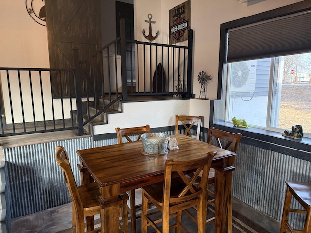 dining area featuring stairway