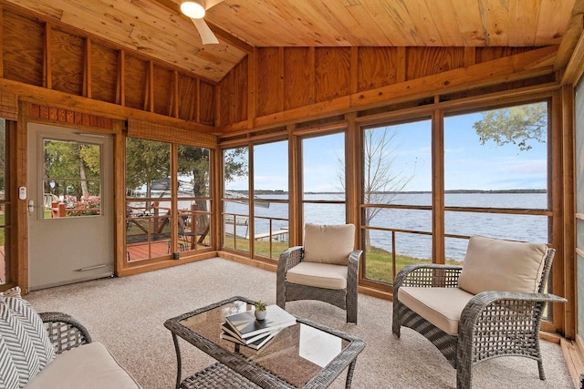 sunroom featuring lofted ceiling, a water view, wood ceiling, and a ceiling fan