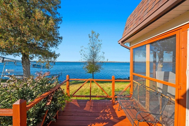 wooden deck featuring a water view