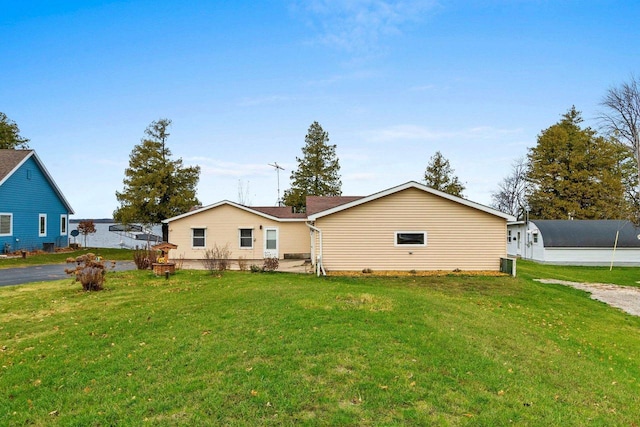 back of house featuring a yard