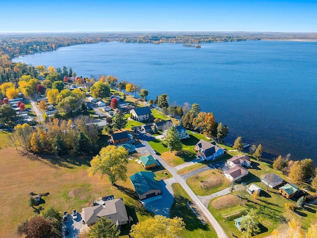 drone / aerial view featuring a water view and a residential view