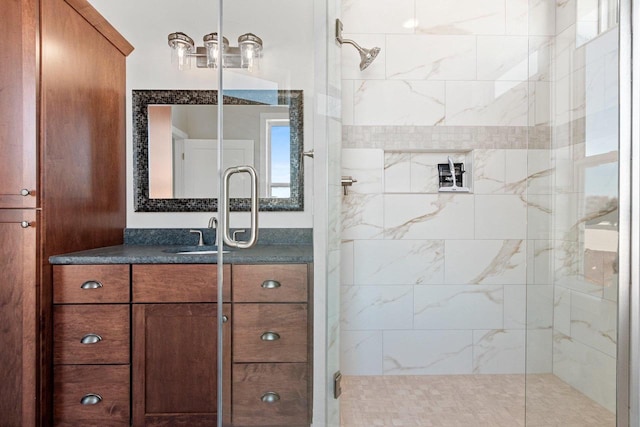 full bathroom with a stall shower and vanity