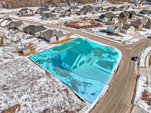 snow covered pool featuring a residential view