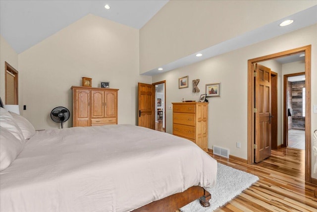 bedroom with light wood-type flooring, baseboards, visible vents, and recessed lighting