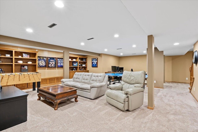 carpeted living area featuring baseboards, built in features, visible vents, and recessed lighting