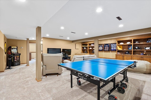 game room with built in features, recessed lighting, light colored carpet, and visible vents