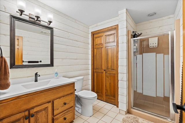 full bath featuring toilet, wooden walls, a shower stall, vanity, and tile patterned flooring