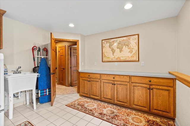 laundry room featuring laundry area, light tile patterned flooring, and recessed lighting