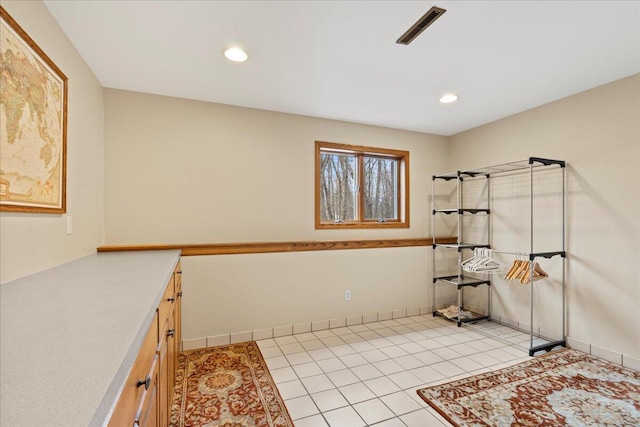 clothes washing area featuring light tile patterned floors, baseboards, visible vents, and recessed lighting