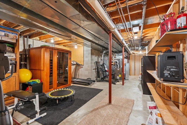 unfinished basement featuring heating unit