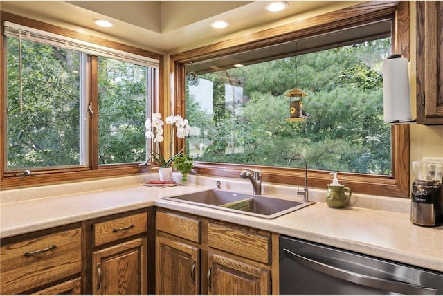 115 Pine Crest Rd, Balsam Lake, WI 54810 - kitchen featuring dishwasher, light countertops, a sink, and a healthy amount of sunlight