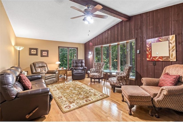 115 Pine Crest Rd, Balsam Lake, WI 54810 - living area with vaulted ceiling with beams, wood walls, light wood-type flooring, and a wealth of natural light