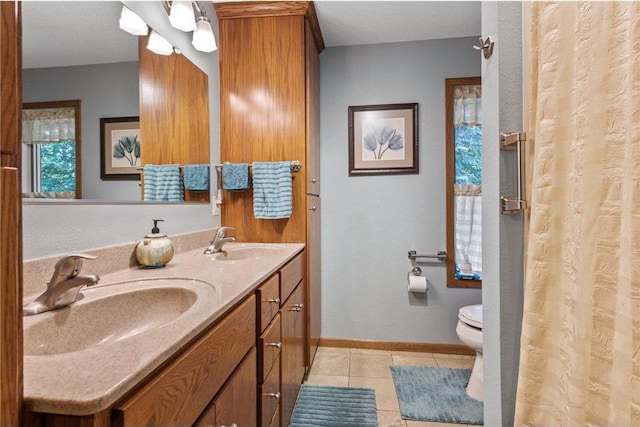 115 Pine Crest Rd, Balsam Lake, WI 54810 - full bathroom with toilet, tile patterned flooring, baseboards, and a sink