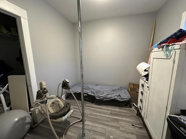 bedroom with wood finished floors