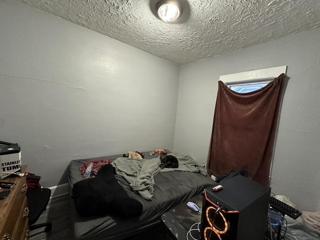 bedroom featuring a textured ceiling