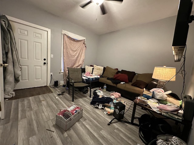 living room featuring ceiling fan and wood finished floors